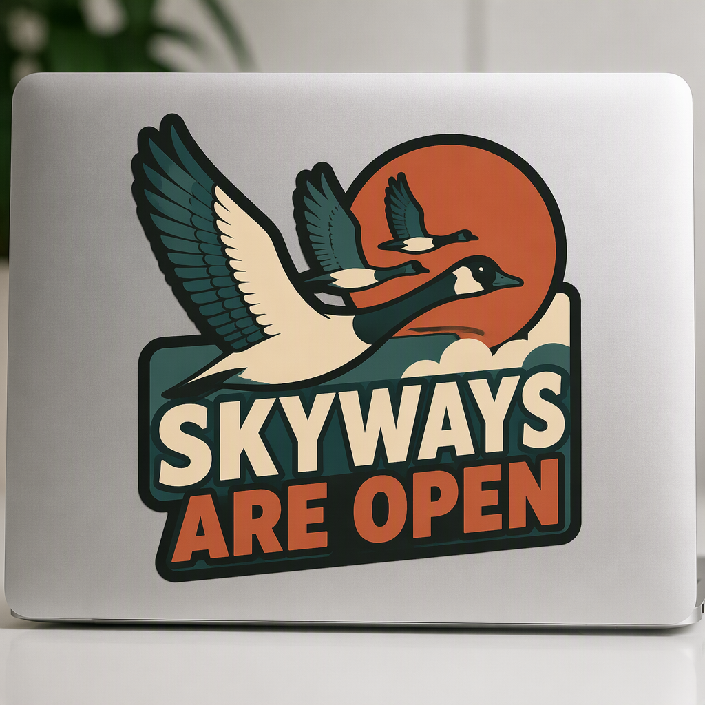 Broad migrating wing shapes sweep around a stylized autumn sun in teal, rust, and ivory, paired with the bold printed message “SKYWAYS ARE OPEN.” This crisp, flat-color die-cut design captures an inspiring sense of movement, open horizons, and the call of the outdoors.