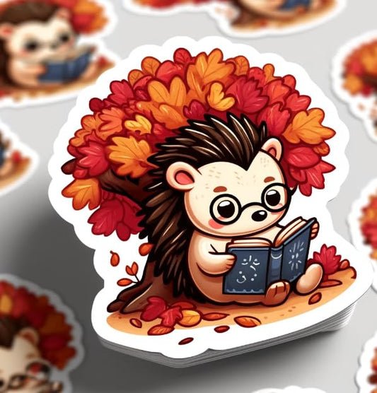 Vinyl sticker: Whimsical Hedgehog Reading Under Autumn Tree Sticker – Perfect for Book Lovers and Educators