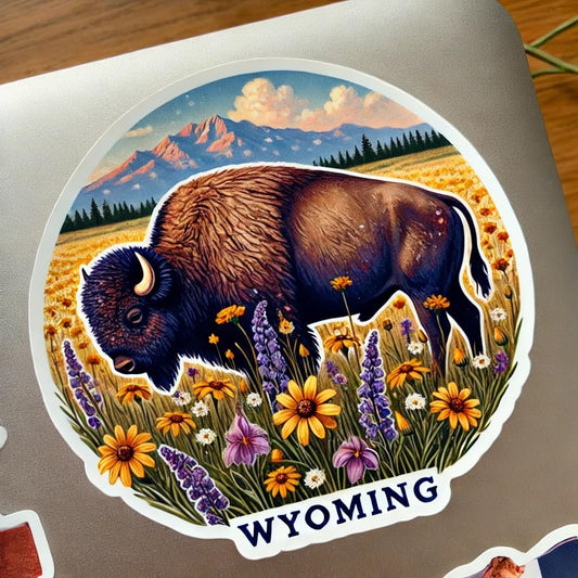 Vinyl sticker: Wildflower Bison Decal for Laptop Car Window Wall Waterproof Sticker – American Buffalo Grazing in Wyoming Meadow with State Flag Floral Art for Truck Auto Bumper Bottle