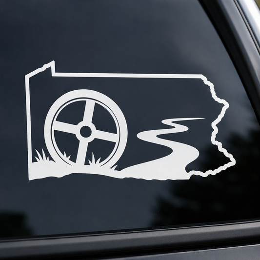 Set within a broad Pennsylvania mainland outline, a covered wagon wheel and river bend create a crisp white decal with a nostalgic backroad-history feel.
