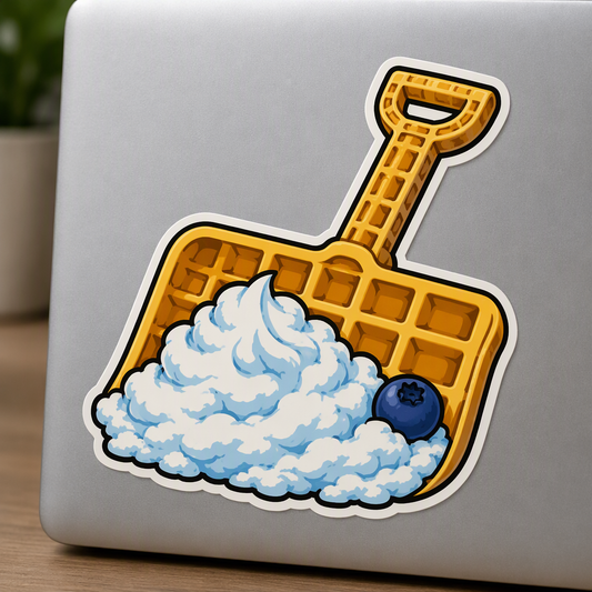 A waffle transformed into a broad snow shovel scoops a fluffy swirl of whipped cream with a single blueberry at its edge in this playful food-mashup design.