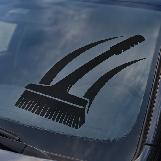A black silhouette shows a broad snow brush resting across a generic car windshield, paired with two large sweeping cleared arcs that capture the familiar motion of brushing away winter snow.
